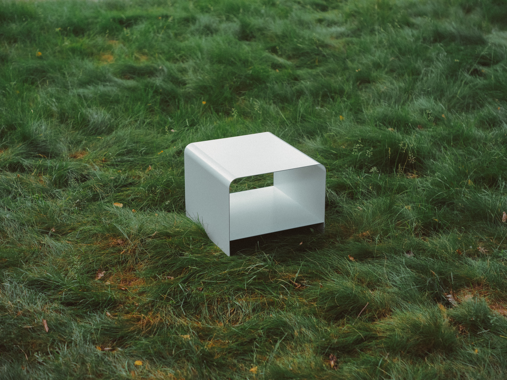 View of MEL's Radius Table sitting in long grass